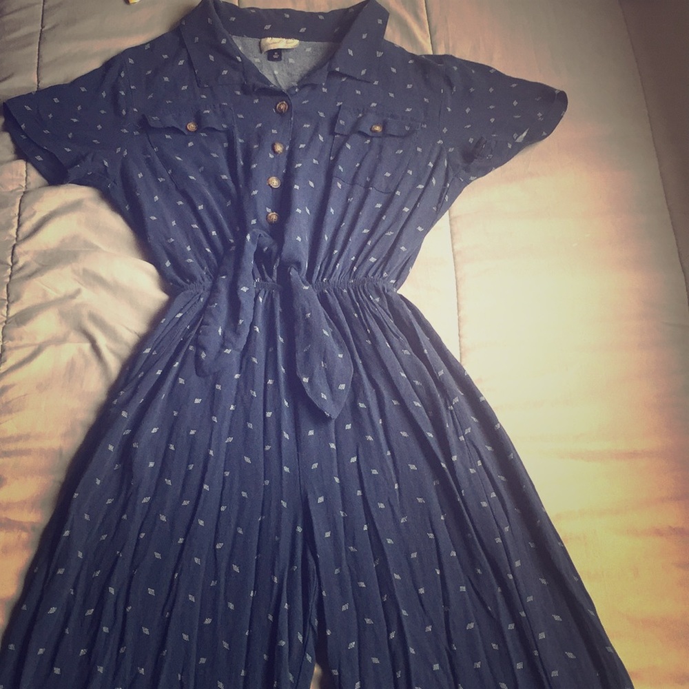 navy blue jump suit with vintage brown buttons.